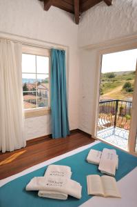 Postel nebo postele na pokoji v ubytování Cesme Elysium Hotel