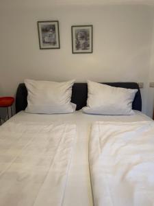 Ένα ή περισσότερα κρεβάτια σε δωμάτιο στο Ferienwohnung Hochfelln +21 φωτογραφίες