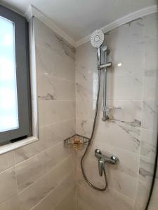Koupelna v ubytování Elite Hotel