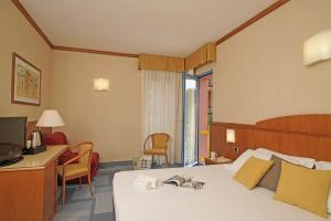 Postel nebo postele na pokoji v ubytování Hotel Sportsman
