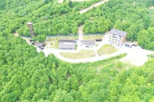 an aerial view of a building in the middle of a forest at Maiden Water Resort in Sarajevo