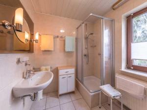 a bathroom with a sink and a shower and a toilet at Ferienwohnung "Juli" Objekt ID 13432-3 in Waren