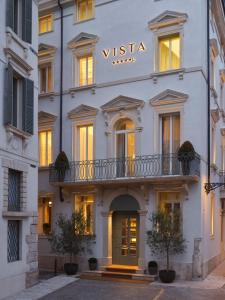 a white building with a sign that reads vista at Vista Palazzo in Verona