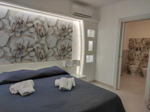 Posteľ alebo postele v izbe v ubytovaní Residence Tre Gemme