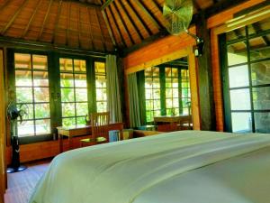 En eller flere senge i et værelse på Pier26 Bali Homestay + 271 billeder