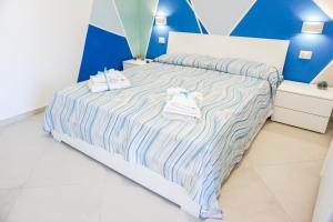 Ένα ή περισσότερα κρεβάτια σε δωμάτιο στο In Centro rooms