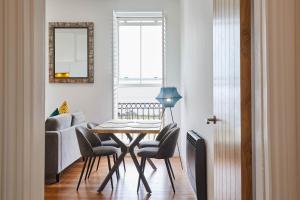 a living room with a table and chairs and a couch at Host & Stay - The Connell in Whitby