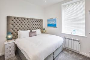 a bedroom with a large bed and a window at Host & Stay - The Connell in Whitby