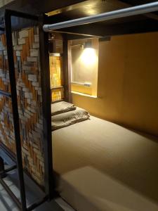 Postel nebo postele na pokoji v ubytování Cebu Pungko-pungko Hostel