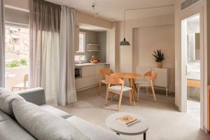 a living room with a couch and a table at Townhouse Lefkada in Lefkada