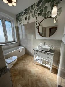Kylpyhuone majoituspaikassa Apartamenty Dobranocka
