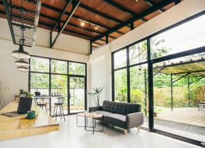 a living room with a couch and a table at Summer Days in Puerto Princesa City