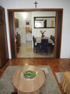 a living room with a table and a dining room at Holiday home TONČICA - Rogotin in Rogotin