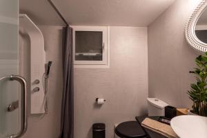 a bathroom with a shower and a toilet and a sink at MS APARTMENT in Athens