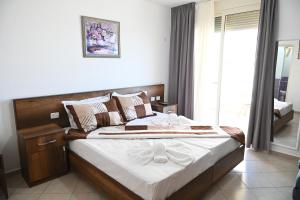 Een bed of bedden in een kamer bij Vila Oxinn