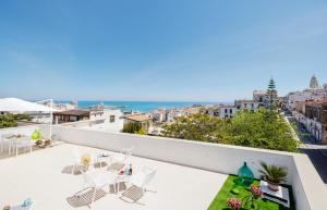 a balcony with chairs and a view of the ocean at B&B La Rosa dei Venti, panoramico nel cuore di Vieste Vista mare Centro storico in Vieste
