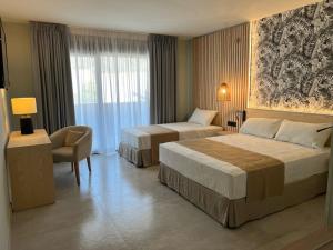 Postel nebo postele na pokoji v ubytování Hotel Noy + 29 fotografií