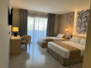 Postel nebo postele na pokoji v ubytování Hotel Noy