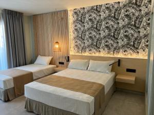 Postel nebo postele na pokoji v ubytování Hotel Noy