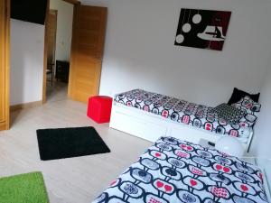 Łóżko lub łóżka w pokoju w obiekcie Casanosa
