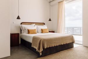 Кровать или кровати в номере White Exclusive Suites & Villas