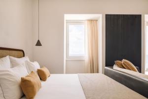 Кровать или кровати в номере White Exclusive Suites & Villas