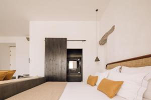 Кровать или кровати в номере White Exclusive Suites & Villas