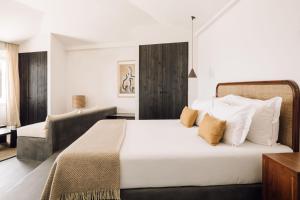 Кровать или кровати в номере White Exclusive Suites & Villas
