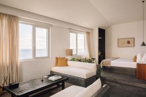 Кровать или кровати в номере White Exclusive Suites & Villas
