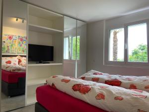 En eller flere senger på et rom på Casa Collina