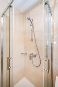 a shower with a glass door in a bathroom at Villa Aurelia in Zadar