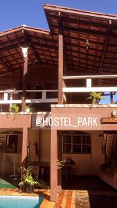 a building with a sign for a hostel park at Hostel Park in Uberlândia