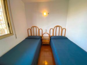 Posteľ alebo postele v izbe v ubytovaní Apartamentos Decathlon