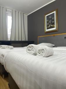 Katil atau katil-katil dalam bilik di Hotel Bentley New