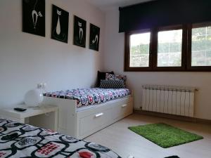 Łóżko lub łóżka w pokoju w obiekcie Casanosa