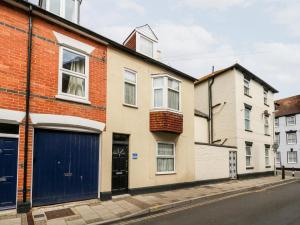 a row of houses on a street at Globe Cottage in Weymouth