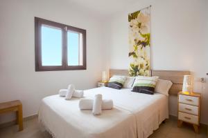 Postel nebo postele na pokoji v ubytování Marina d'Or IV, casa 5