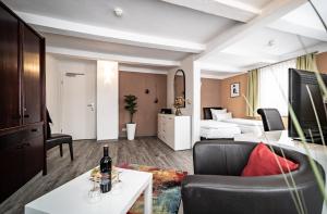 TV a/nebo společenská místnost v ubytování Le petit Palais - Hotel/Pension