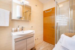a bathroom with a sink and a shower at Villa Aurelia in Zadar +68 photos