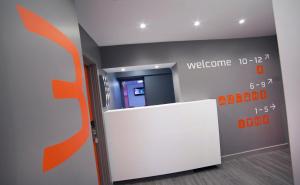 an office with a welcome sign on the wall at Sleeperdorm in Newcastle upon Tyne