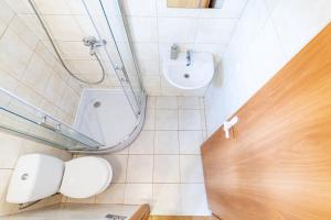 a bathroom with a toilet and a sink at Kopų 32 Šventoji in Šventoji +24 photos