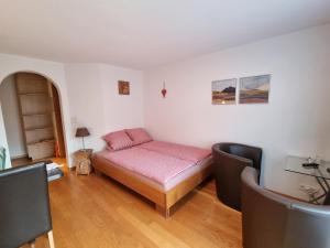 Giường trong phòng chung tại MOM - Alpine Boutique Apartments, Chalet Fagus, Terrace Studio