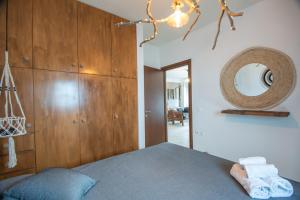 Postel nebo postele na pokoji v ubytování Chrisambelos Apartments