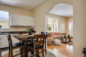 a kitchen and living room with a table and chairs at Pinwheel Place in Jacksonville