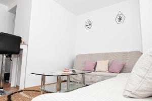 a living room with a couch and a coffee table at Jajce Youth - Camp and Accommodation in Jajce