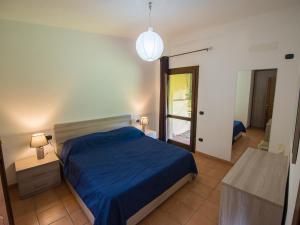 Кровать или кровати в номере Residence Cala Petralana