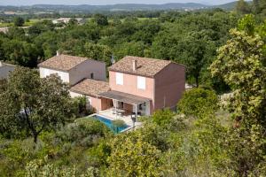an aerial view of a house with a pool at Petit Paradis Garrigue in Moulézan