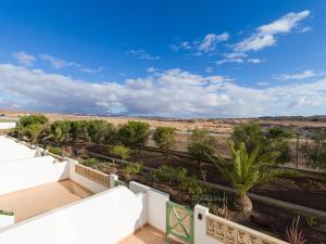a view of the desert from the balcony of a house at HomeForGuest Apartamento con Piscina en Caleta de Fuste in Caleta De Fuste