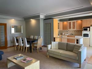 a living room with a couch and a table at Faraway Lake in Ferreira do Zêzere