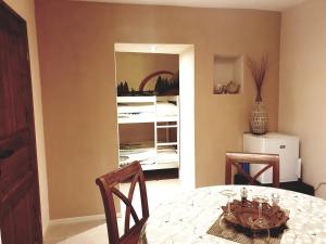 a dining room with a table and two chairs at B&B Margarita in Cerkovna